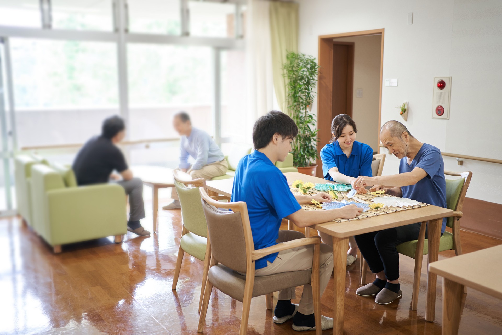 Elderly people and caregivers recreation in nursing care facilities